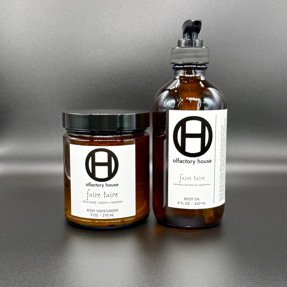 Faire Taire moisturizing body care duo on a black background, with body moisturizer and body oil.