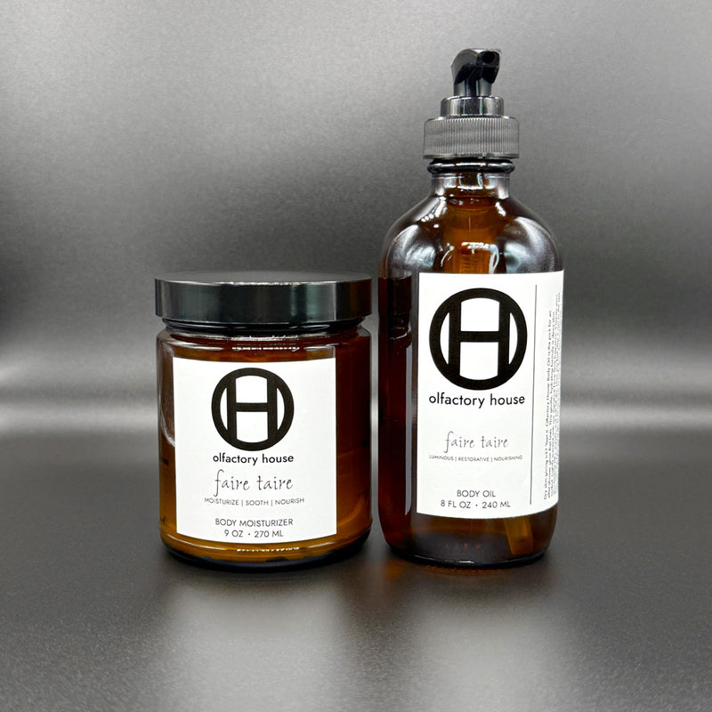 Faire Taire moisturizing body care duo on a black background, with body moisturizer and body oil.