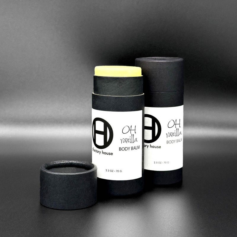 Olfactory House Vanilla body balm comes in a cardboard tube with a  pull off lid. The balm is dispensed by pushed up on the bottom of the packaging. 
