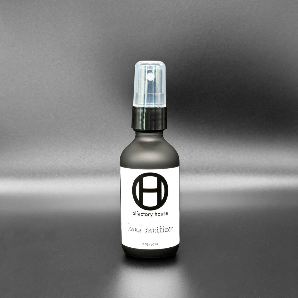A 2 oz bottle of Olfactory House Hand Sanitizer spray. 