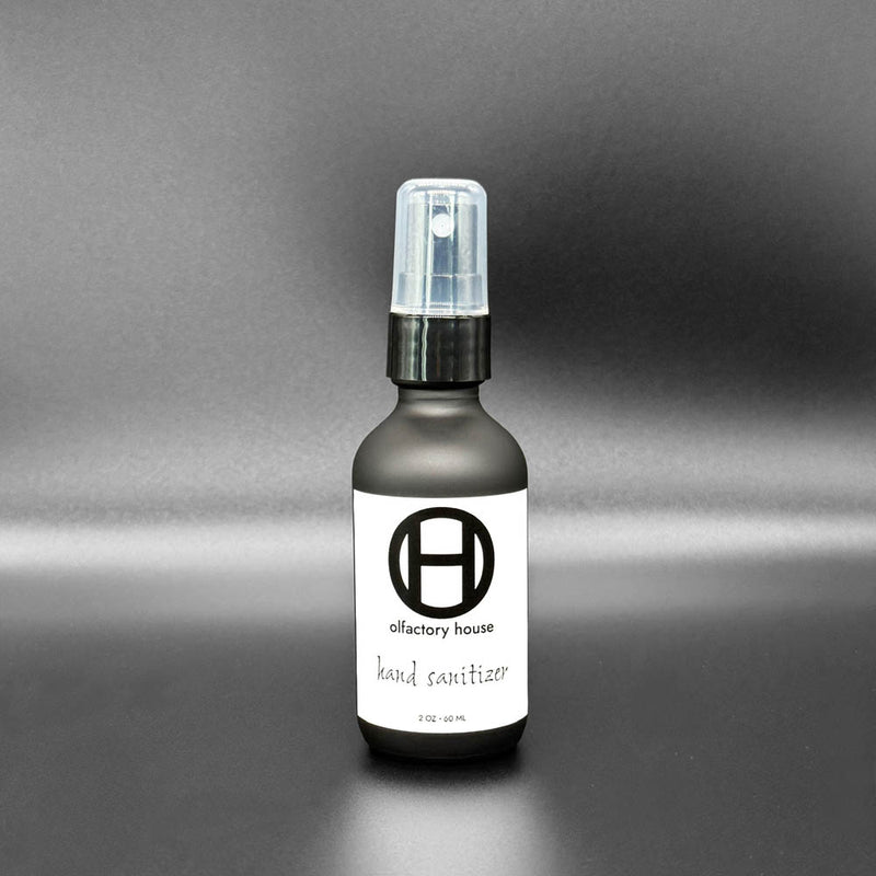 A 2 oz bottle of Olfactory House Hand Sanitizer spray. 